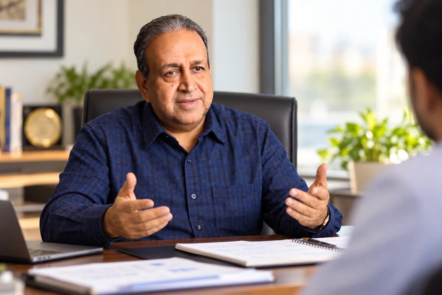 Bajrang Khaitan advising a client across his desk